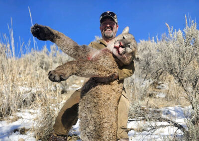 Lion Hunter holding prize.